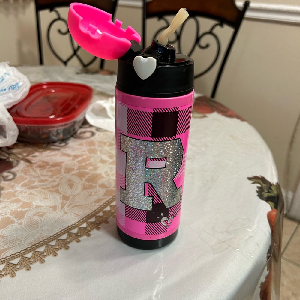 This is an R shaped pink lighted water bottle for girls